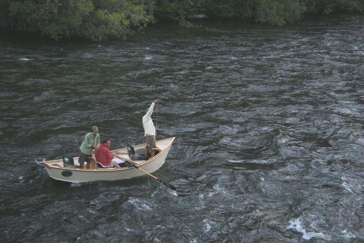 Trout fishing by driftboat on the South Fork of the Boise River.