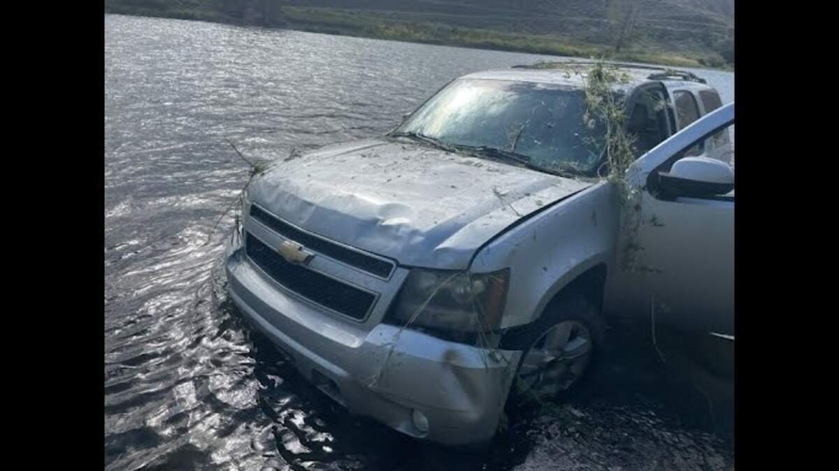 Michelle Visser’s 2010 Chevy Tahoe sits in the Salmon River on Sept. 17, 2023. Visser’s family hired Whitewater River Shuttle to move the vehicle from Salmon to Carey Creek, but the driver crashed the car shortly outside Salmon.