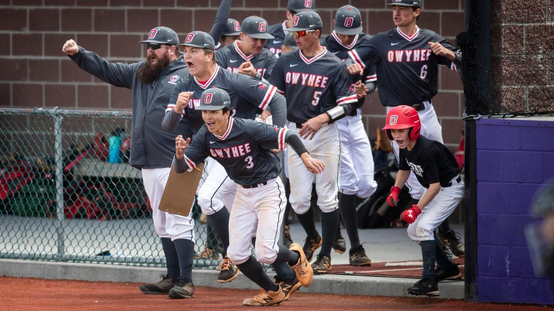 Owyhee charges the field to celebrate its 6-4 win over Lewiston in the 5A baseball state tournament at Wolfe Field in Caldwell on Thursday.