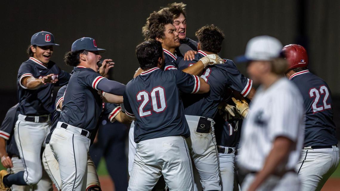 Owyhee, looking for three straight state titles, celebrates after Cade Walker’s game-winning hit with two outs in the bottom of the ninth inning.