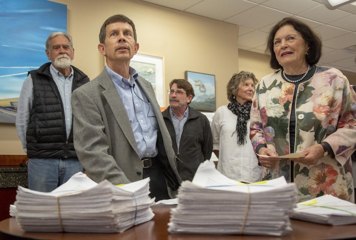David Klinger, left, spokesman for Boise Working Together, and Adelia Simplot, president, speak to media before the group presents signatures to the Boise city clerk in April. The group collected more than 14,000 signatures to put the city’s stadium and library on the ballot in November. Ada County officials have 60 days to verify the signatures.
