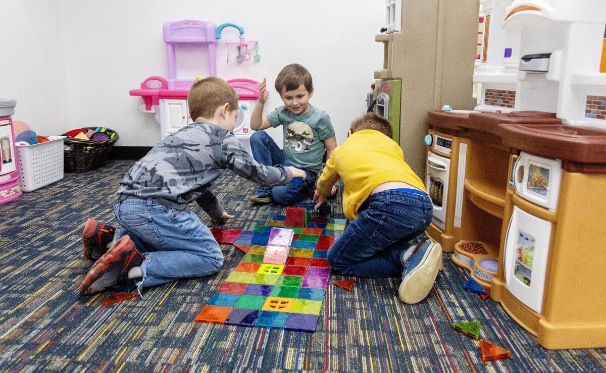 Children engage in playtime at God’s Creation child care center. A growing body of research has linked high-quality early childhood education with improved health and social outcomes later in life.