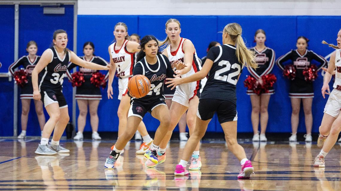 Columbia sophomore Yani Lincoln passes to sophomore Gabby Nabors in the first period of their game against Shelley in the 4A state tournament Thursday at Timberline High School.