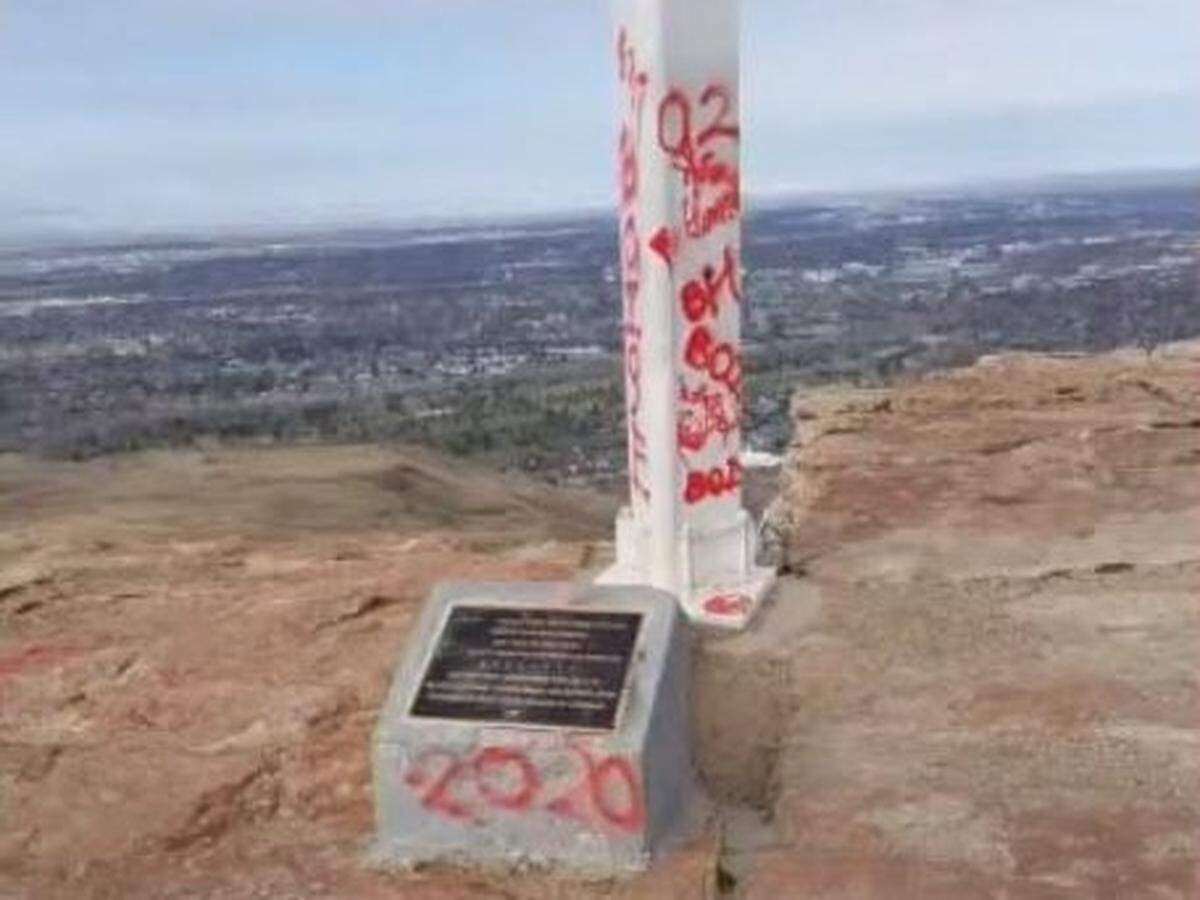 Graffiti on a plaque and post at Table Rock in 2020. Neighbor Doug Bates showed this photo to Ada County Highway District commissioners in October 2020 as he made an ultimately successful case to curb access to Table Rock from the upper portion of Table Rock Road.