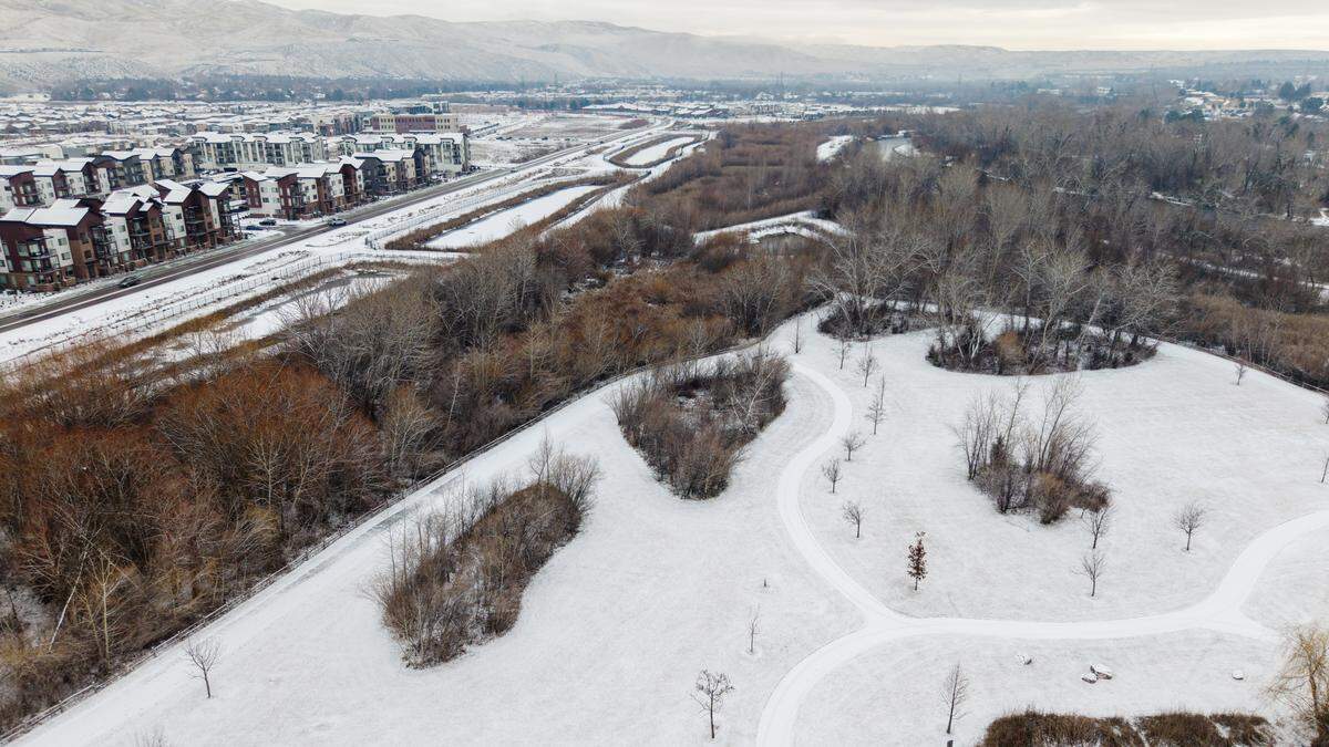 Snow covers the ground at Marianne Williams Park.