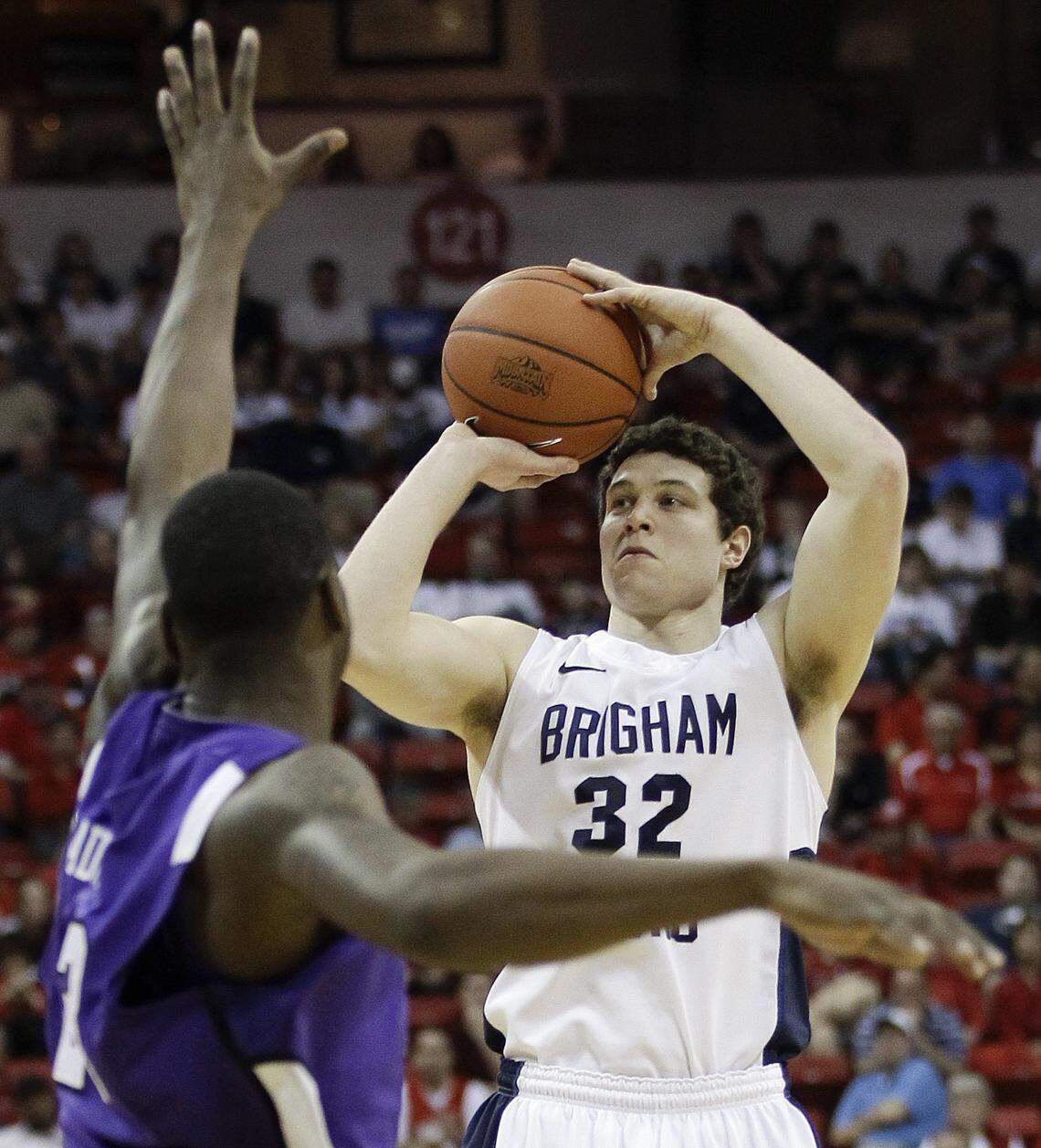 BYU’s Jimmer Fredette puts up a 3-pointer in 2011 over TCU’s J.R. Cadot. Fredette left college as the top 3-point shooter in Mountain West history.