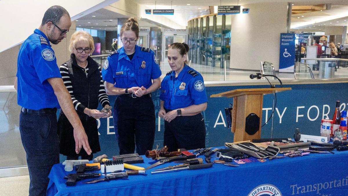 Transportation Security Administration officials go over a collection of prohibited carry-on items during a press conference at the Boise Airport, Wednesday, Jan. 8, 2025. Pictured from left, officer Kleber Almeida, TSA public affairs representative Lorie Dankers, and officers Naomi Drake and Laurie Pearson.