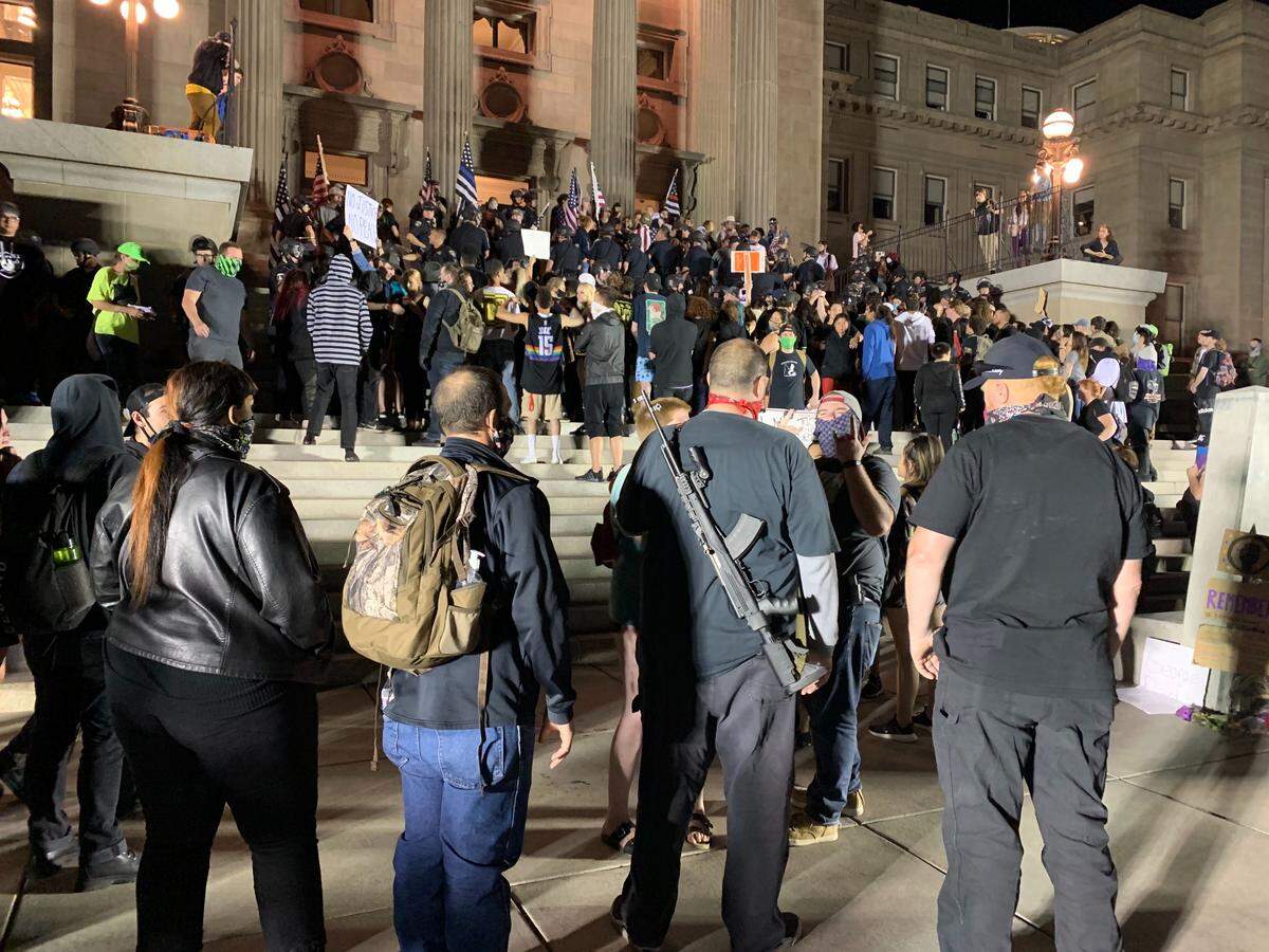 At 1:30 Wednesday morning, hours after the end of a peaceful vigil, groups of protesters and scores of law enforcement were still gathered on the Idaho Capitol steps.