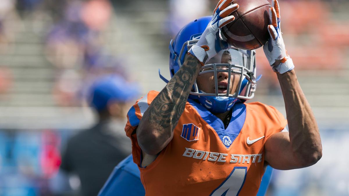 Boise State safety DeAndre Pierce grabs a pass during drills in front of Bronco fans at Albertsons Stadium on Saturday, Aug. 25, 2018.