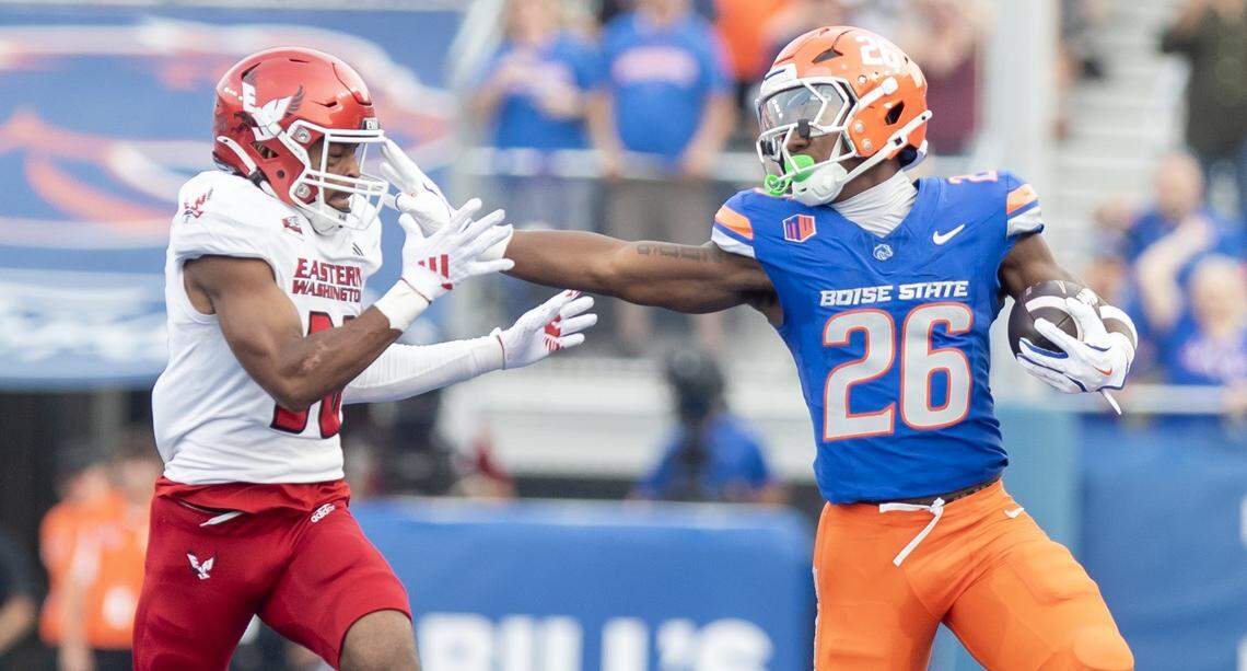 Boise State running back Sire Gaines throws a stiff arm on Eastern Washington cornerback Jonathan Landry during a 46 yard first quarter run. Boise State defeated Eastern Washington 51-14 in the Broncos' home opener at Albertsons Stadium, Sept. 5, 2025.