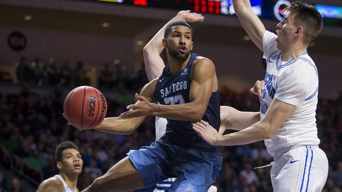 Borah High grad Isaiah Wright wraps a pass around BYU’s Zac Seljaas last season in the West Coast Conference tournament. Wright is entering his senior season with San Diego.