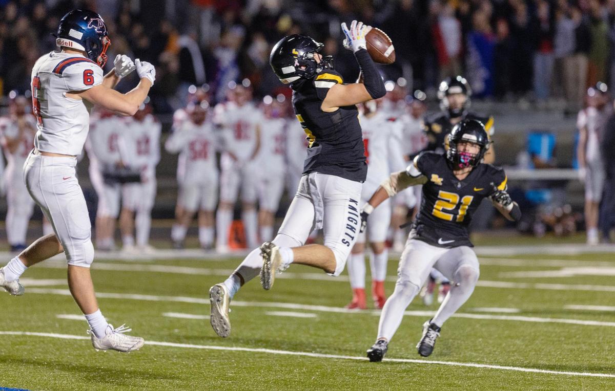 Bishop Kelly junior defensive back Cole Traverso intercepts the ball in the fourth quarter of the Knights’ 28-18 win over Pocatello on Friday in the semifinals of the 4A state playoffs at Bishop Kelly High.