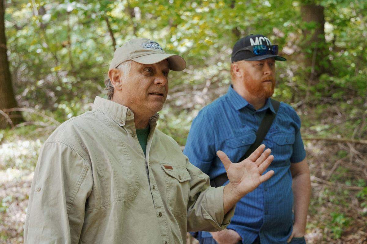 Nick Maimer, right, and Perry Blackburn offer advice to members of Ukraine’s Territorial Defense Force battalion.