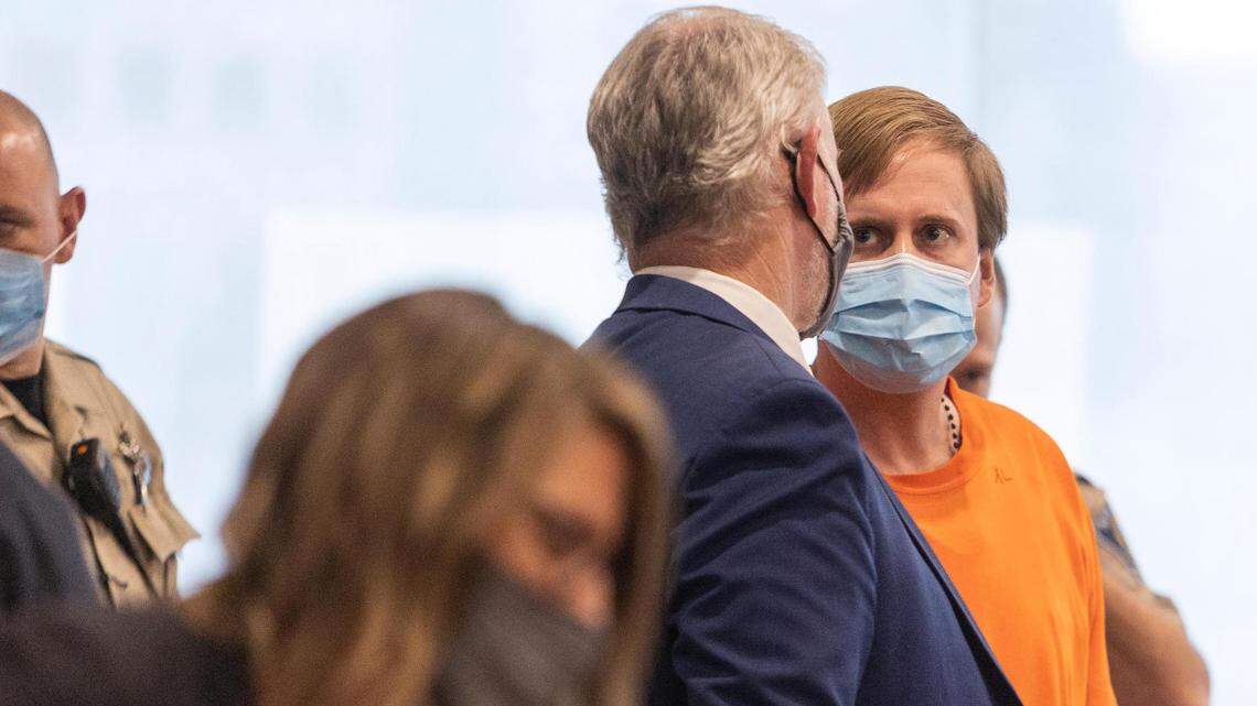 Attorney Jon Cox, left, speaks with Aaron von Ehlinger as court is recessed after sentencing at the Ada County Courthouse on Wednesday.