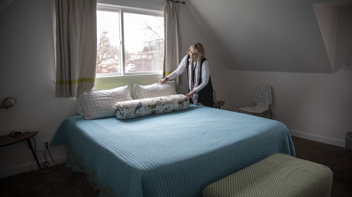 Kat Wright tidies up the carriage house Airbnb in Hyde Park. Boise City Councilors were asked to consider an ordinance requiring short-term rentals to register with the city annually.