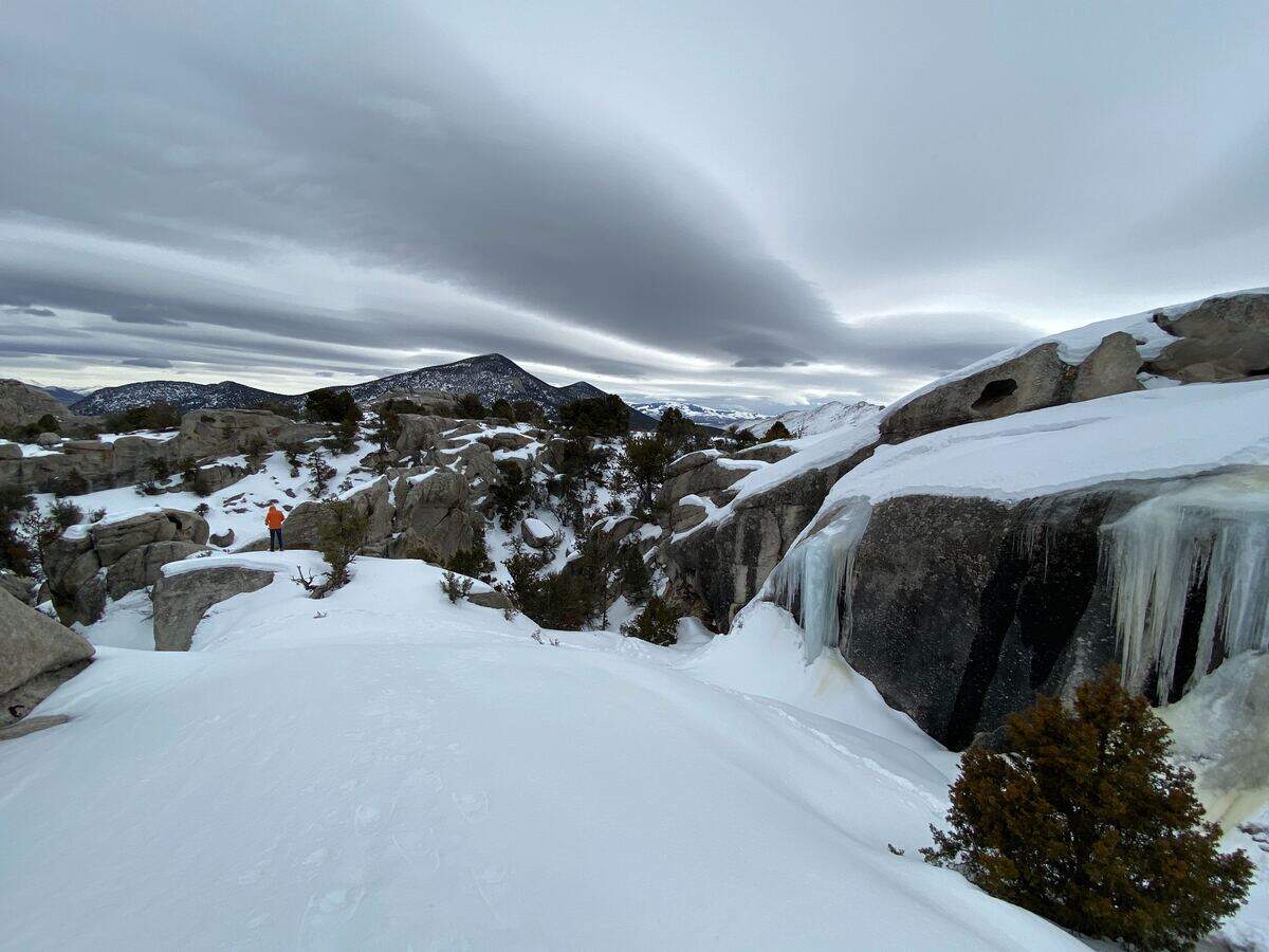Max Graham stands at the edge of a rock outcropping at City of Rocks National Reserve on Saturday, Feb. 15, 2020.