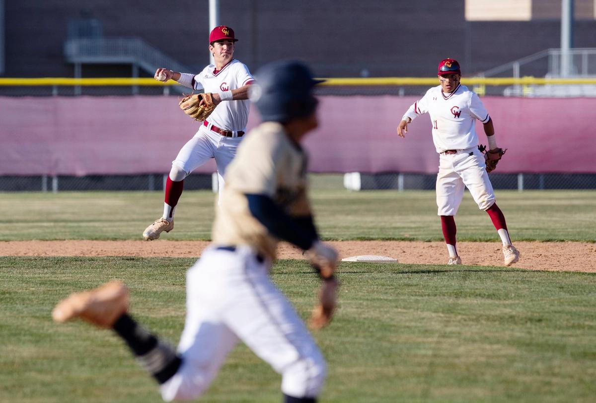 Middleton junior Isaiah Anzaldua, front, breaks for first base while Columbia infielder junior Caden Campa winds up for the throw Friday.