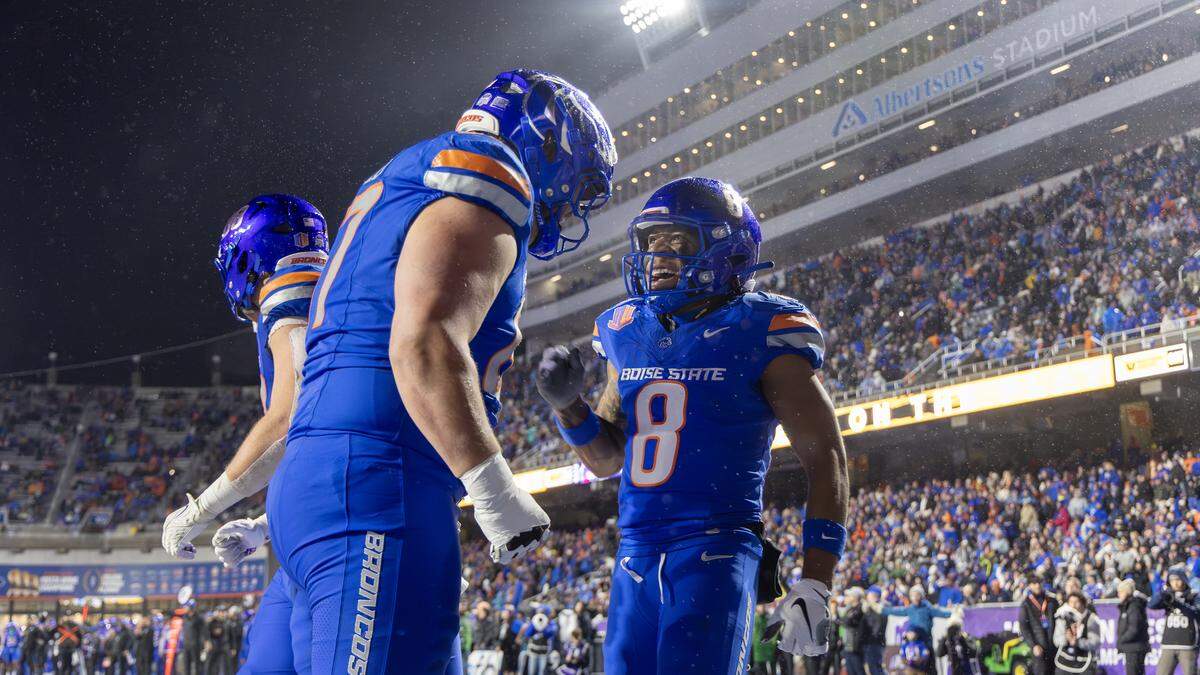 Boise State running back Malik Sherrod (8) celebrates after a 39-yard touchdown in the second quarter of the Mountain West title game against UNLV at Albertsons Stadium.