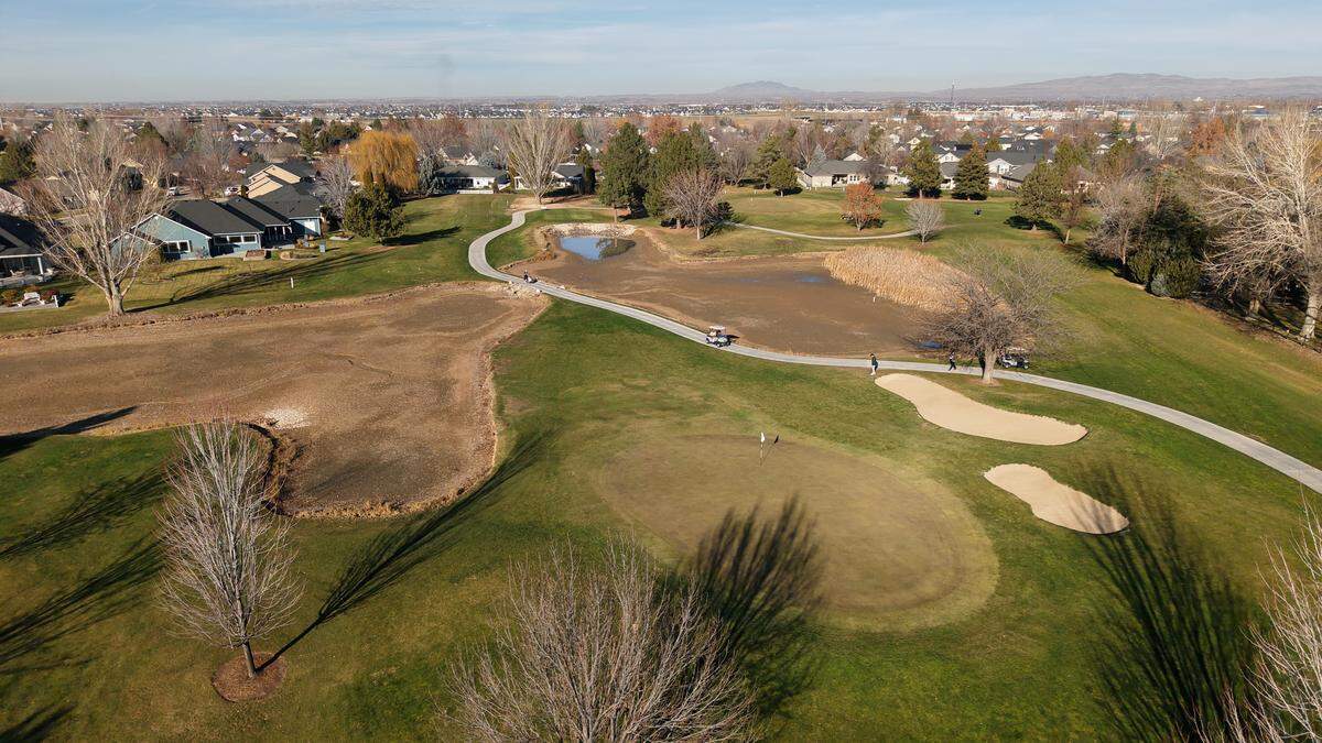 Homes surround Lakeview Golf Course in Meridian, where golfers take advantage of an unseasonably warm December day.