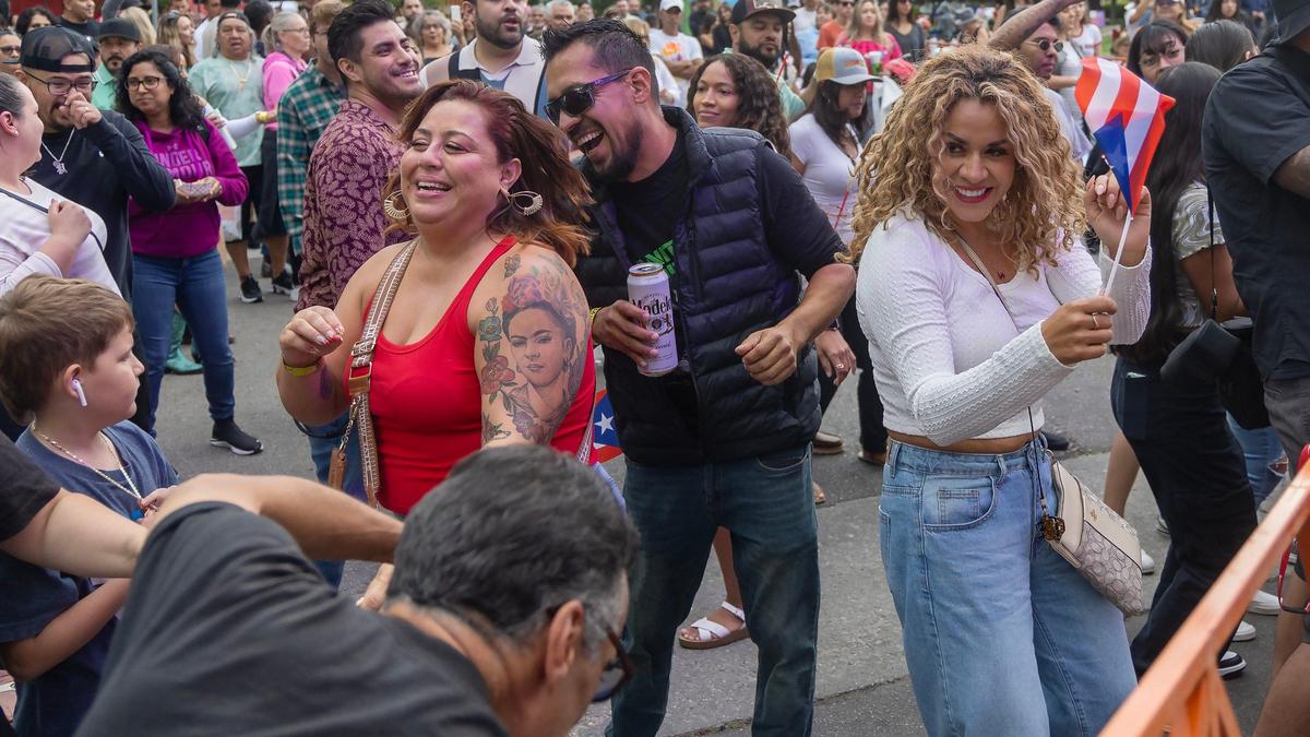 People dance to Latin American music at Latino Fest in at Cecil Andrus Park downtown Boise on Saturday.