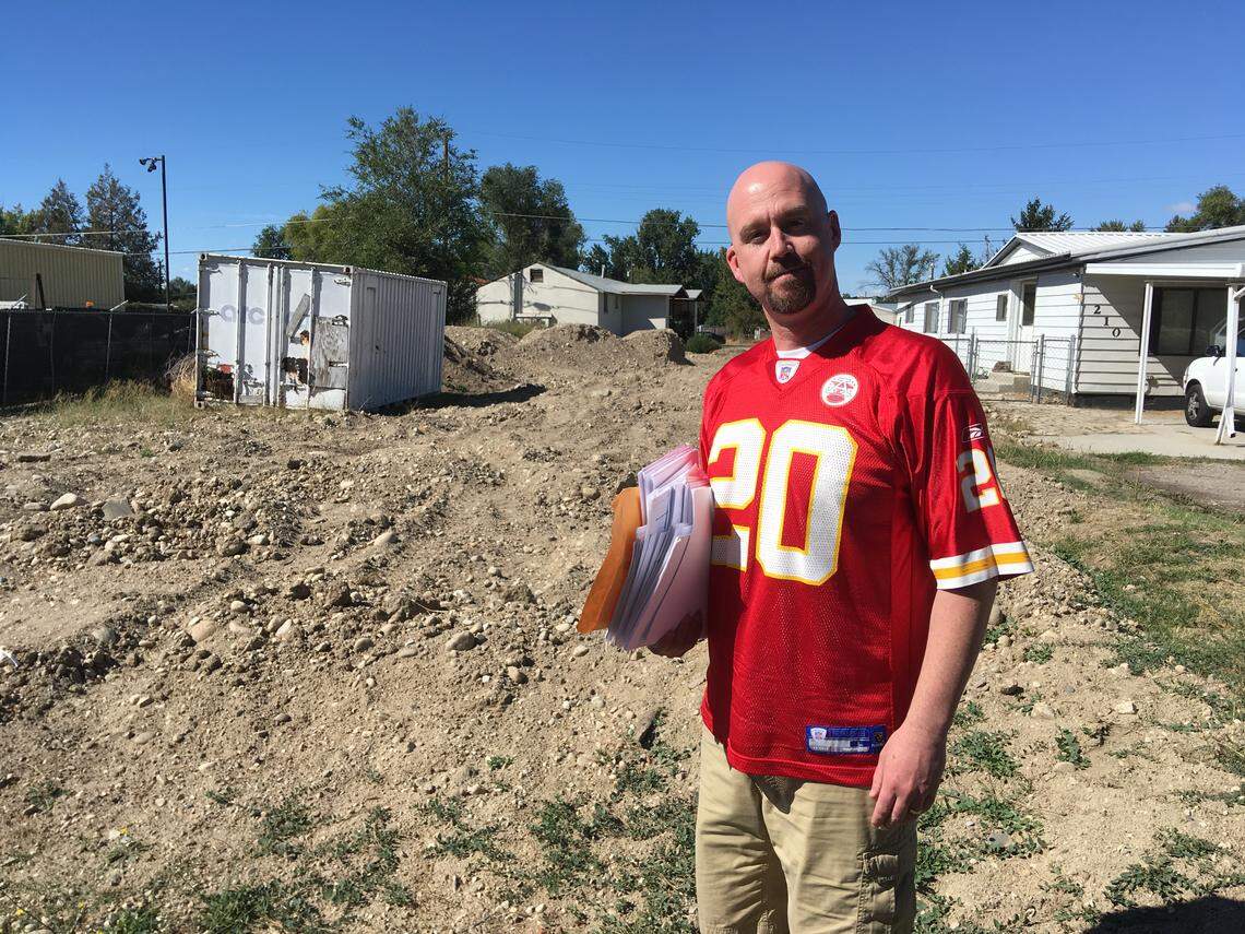 Jason Jones stands in front of the property he owns at 208 33rd St. in Garden City.