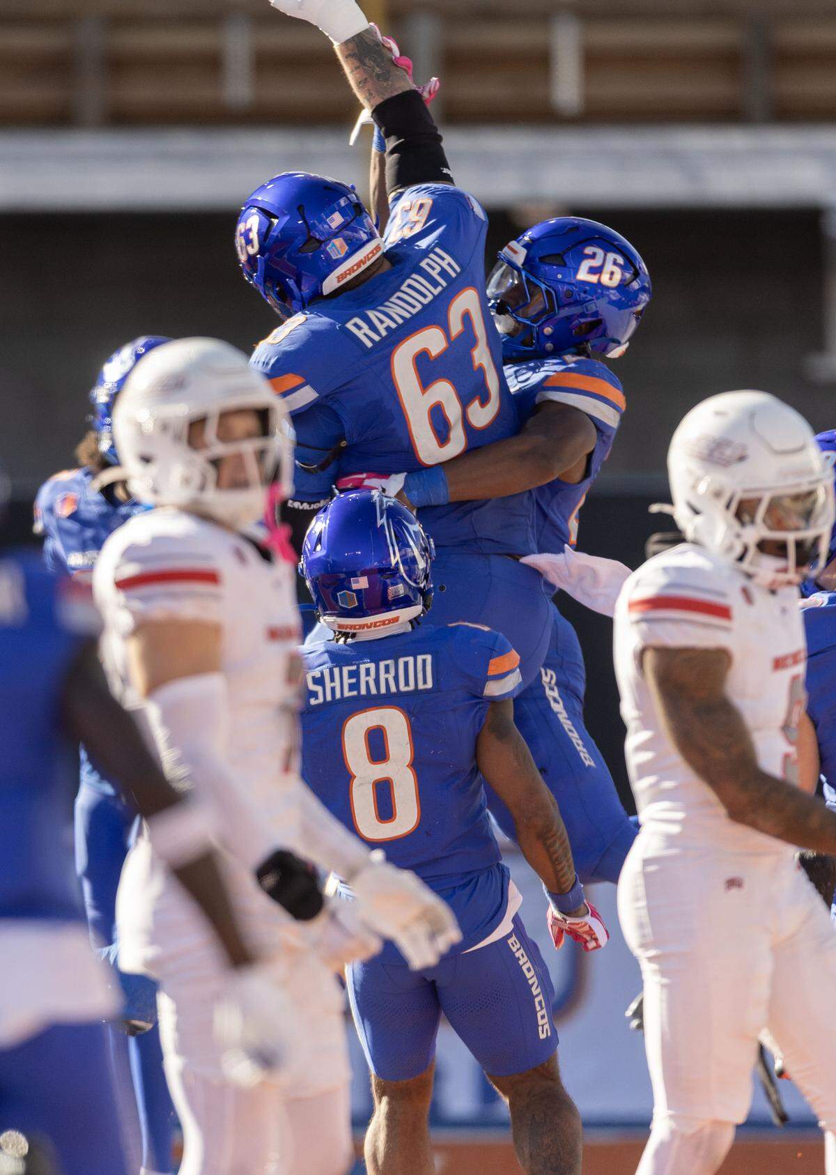 Boise State running back Sire Gaines and offensive lineman Mason Randolph celebrate a rushing touchdown against UNLV this season.