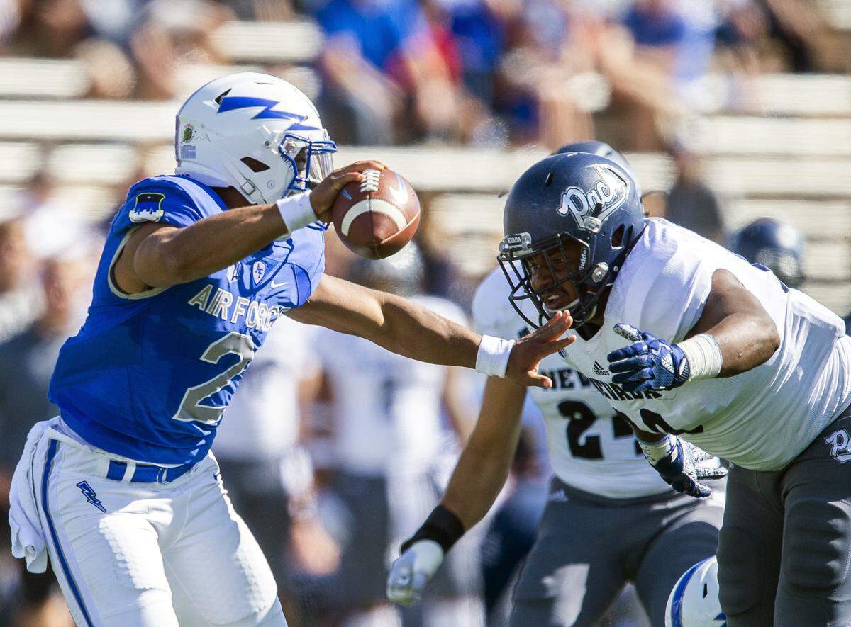 Air Force quarterback Arion Worthman is sacked by Nevada linebacker Malik Reed during the first half Sept. 29 in Colorado Springs, Colo.