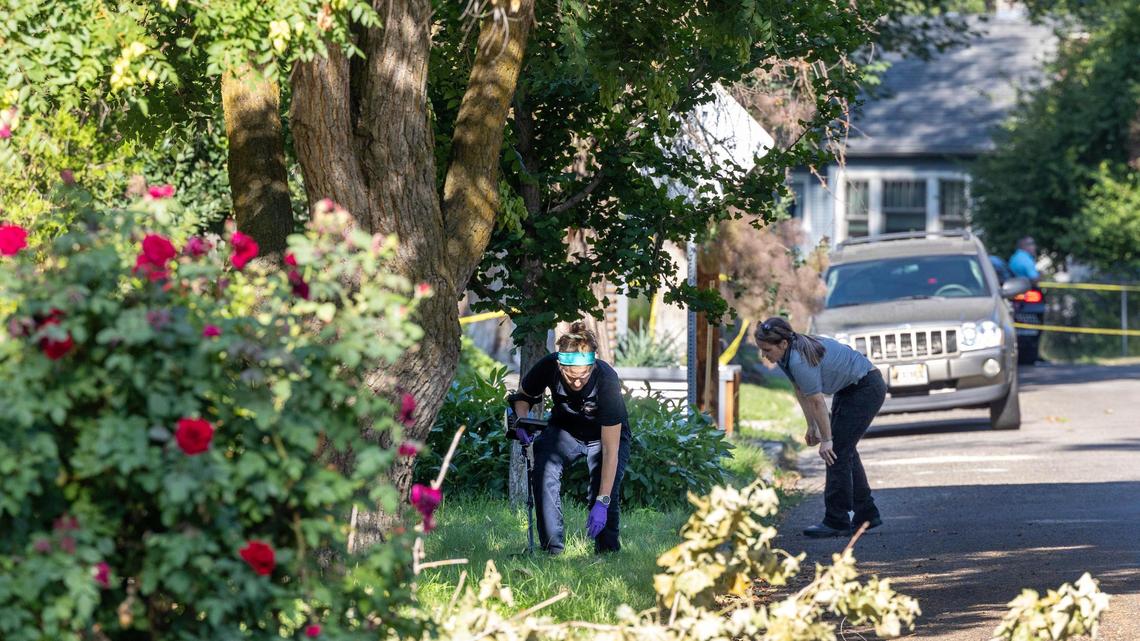 Officials work around the perimeter of a multiblock crime scene Thursday after a fatal shooting Wednesday night near the 700 block of N. 20th Street in Boise’s North End.