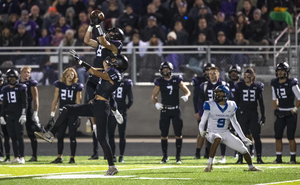 Rocky Mountain defensive back Trevor Van Gerpen intercepts a pass intended for Timberline’s Nicolas Caballero in the second half Friday at Rocky Mountain High.