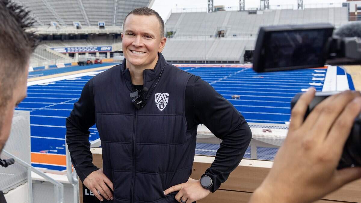 Boise State football head coach Spencer Danielson wears a Pac-12 logo vest during the Pac-12 Launch Party event at Albertsons Stadium, Tuesday, June 30, 2026. Boise State Athletics officially moved to the revived Pac-12 Conference on July 1. The move ends a 15-year tenure in the Mountain West Conference for Boise State.