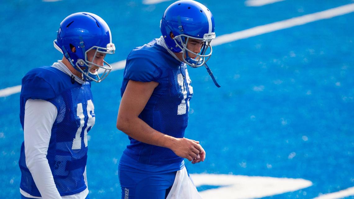 Boise State quarterbacks Hank Bachmeier, right, and Jack Sears warm up during fall camp on The Blue at Albertsons Stadium on Sunday, Aug. 8, 2021.