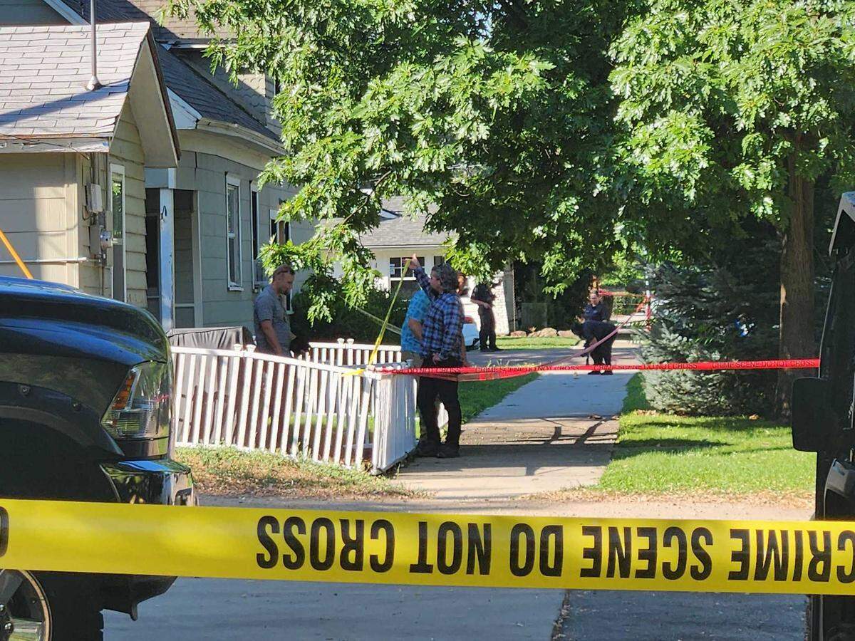Police investigate a multi-block crime scene at 19th and Resseguie Streets after an overnight shooting on Thursday, July 27.