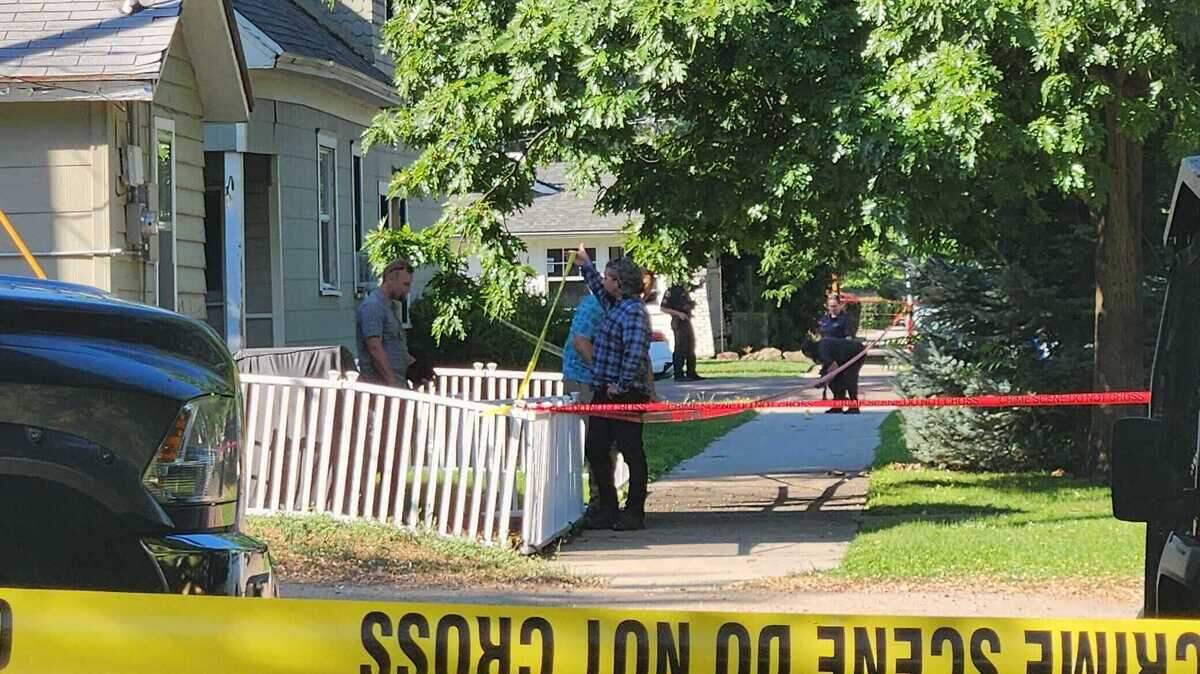 Police investigate a multiblock crime scene on July 27 at 19th and Resseguie Streets after an overnight shooting that left a suspect dead.