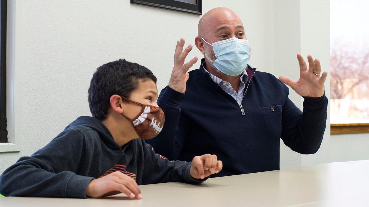 Oliver Maron describes the large hamburger and shake at one of he and his “little” Cordell Hayle, 11, favorite eating spots. The two participate in the Big Brothers Big Sisters program in Boise.