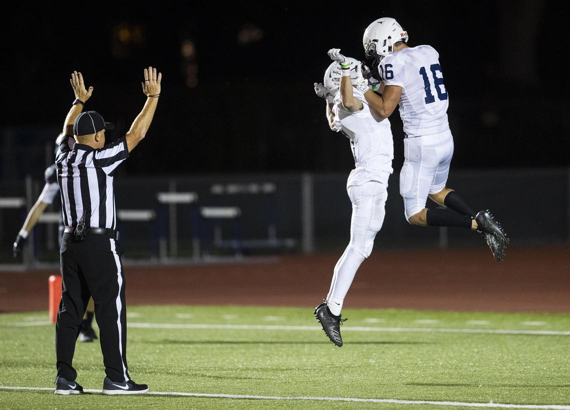 Mountain View wide receiver Colby Peugh celebrates a 85-yard catch and run with teammate Kayden Chan in the fourth quarter Friday, Sept. 13, 2019 at Dona Larsen Park in Boise. The Mavericks scored 21 unanswered points against Capital in the second half, winning the 5A SIC game 21-14.