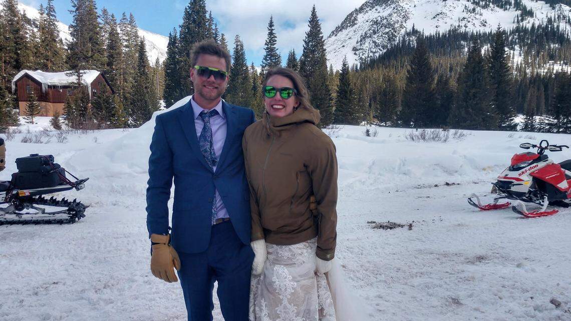 The newly married couple happily posed for the search-and-rescue team.