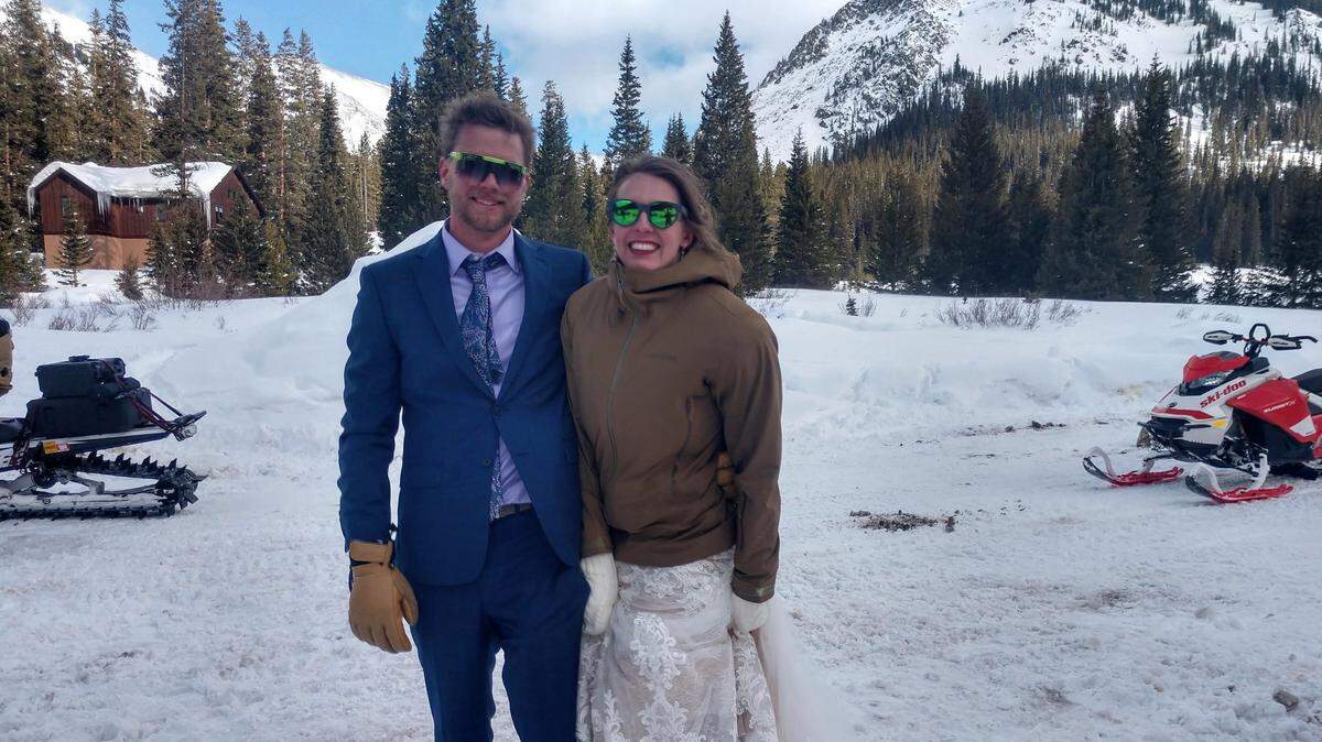 The newly married couple happily posed for the search-and-rescue team.