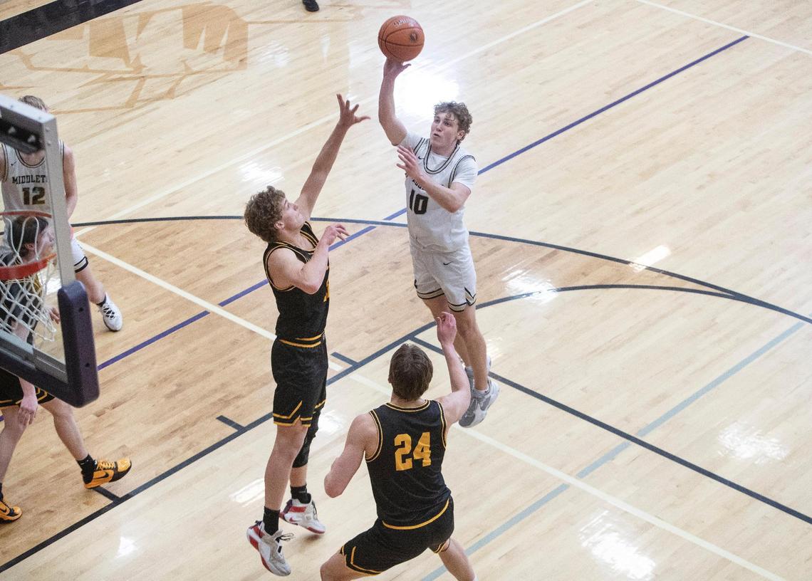 Middleton junior Talmage Stucki puts up a jumper in the win over Bishop Kelly. Stucki led the Vikings with 13 points.
