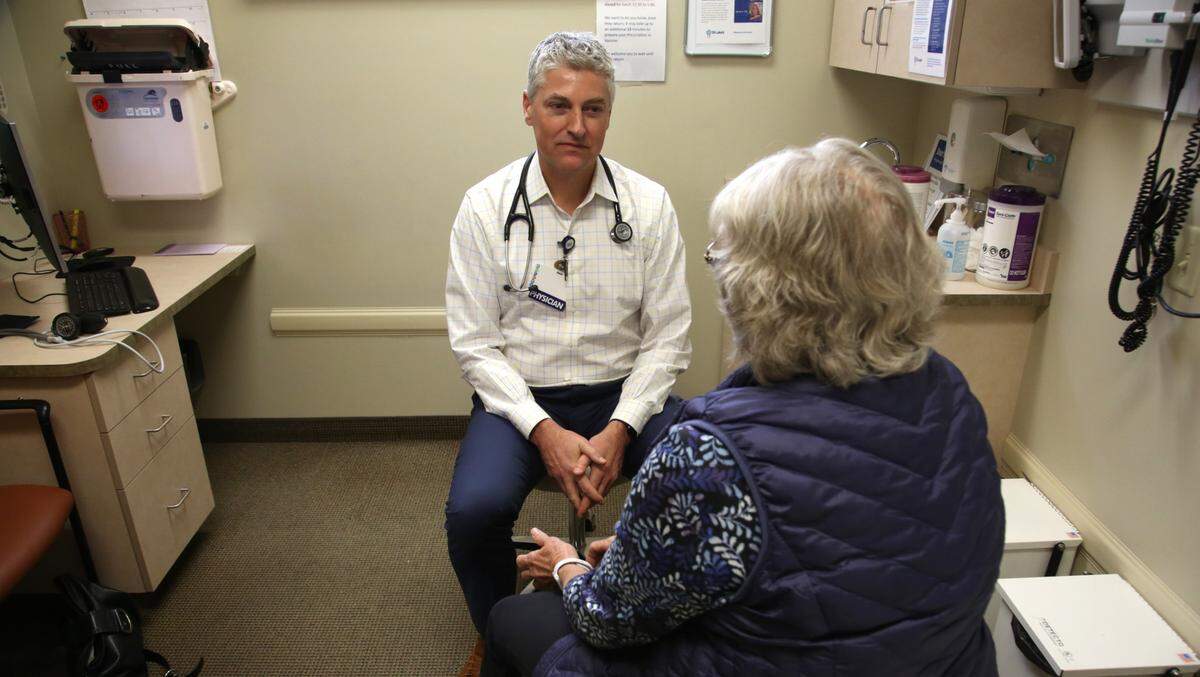A doctor and patient at St. Luke’s Health System in 2024.