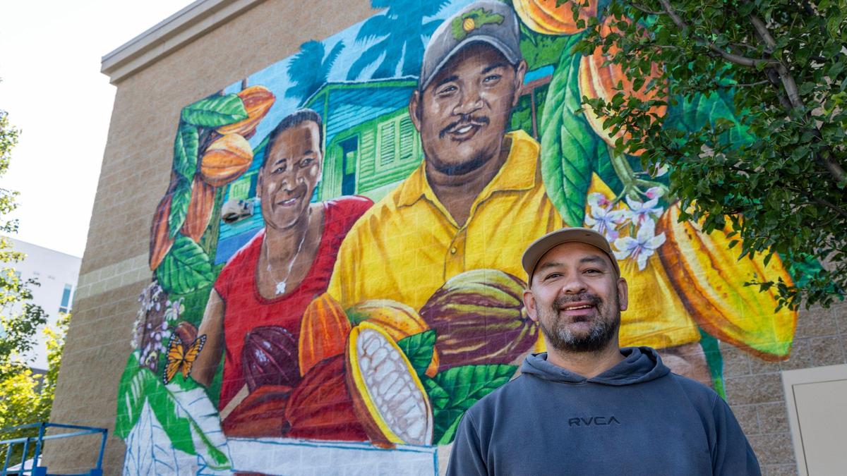 Artist Bobby Gaytan is creating a mural at Boise Co-op’s Meridian location. The artwork depicts two siblings who are cacao farmers in the Dominican Republic.