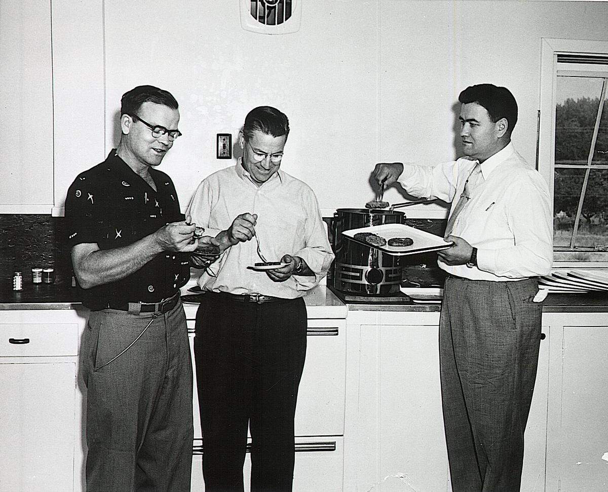 Brothers Golden Grigg, left, and Nephi Grigg, right, who founded Ore-Ida and invented Tater Tots, taste company products in 1960. In the middle is brother-in-law Otis Williams, a company vice president who provided financial backing.