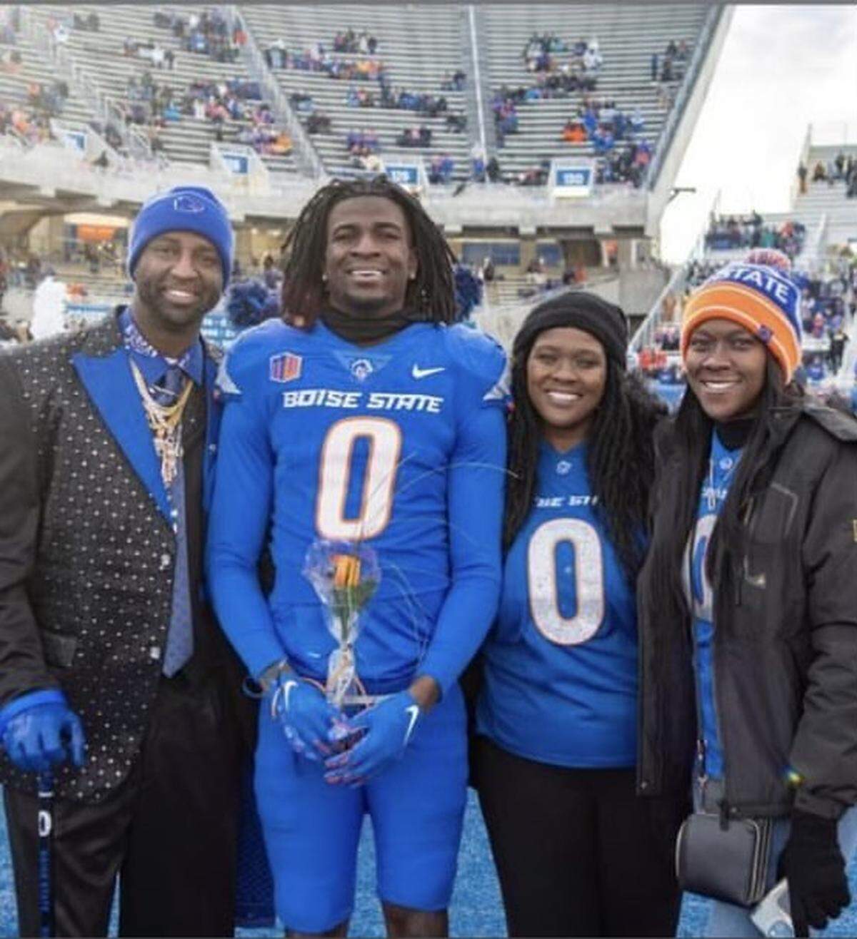 Boise State safety JL Skinner with his father, whose name is also JL (left), mother Thomasina Alexander (second from right) and sister, Teri, during the Broncos’ senior day ceremony before their 42-23 win over Utah State.