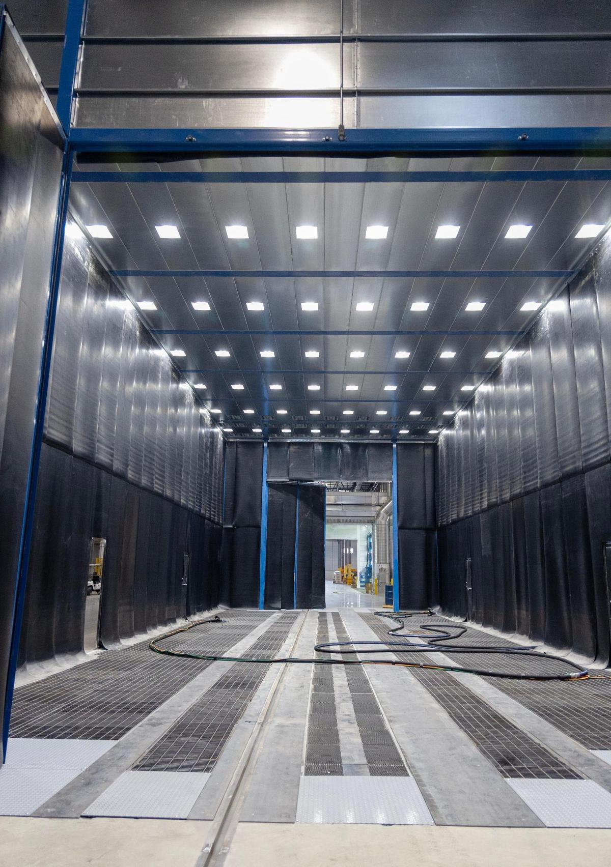 The air blasting booth blows off any metal particles left after welding.