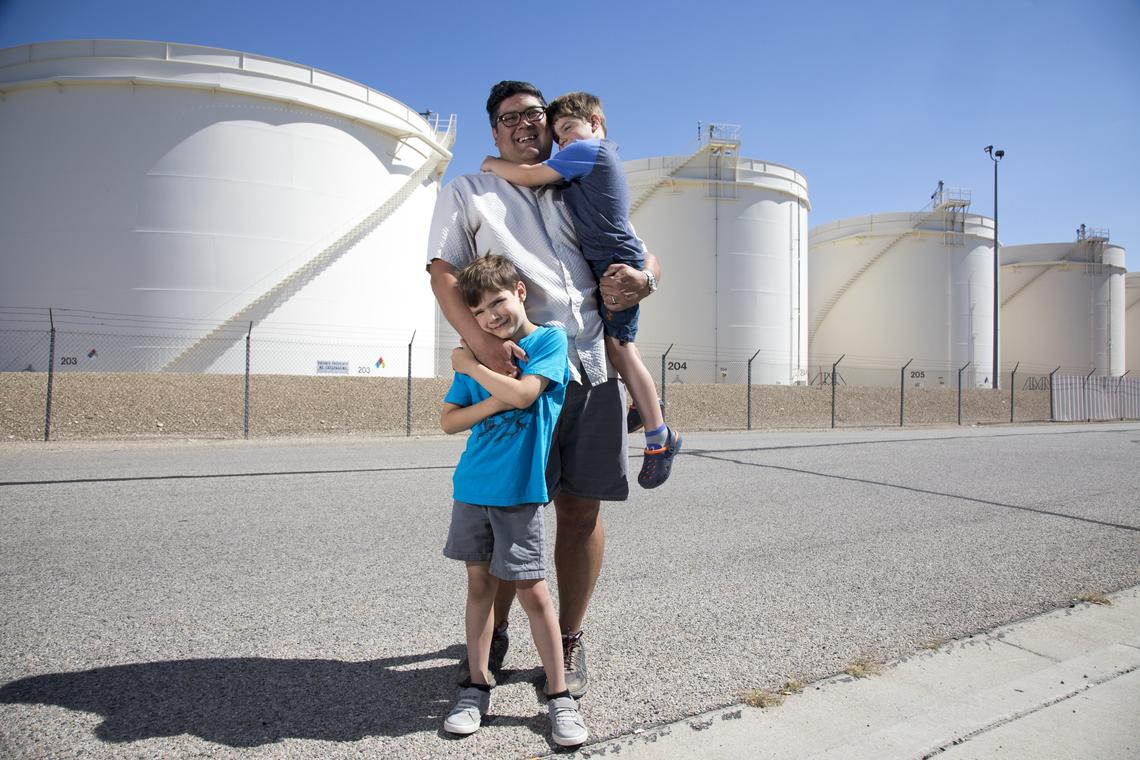 Randy Johnson, president of the Central Bench Neighborhood Association (with his sons, Oliver, left, 8, and Quincy, 5), would like the fuel tank farm near his neighborhood replaced with a mixture of residential and commercial development that leaves some space open to the public.