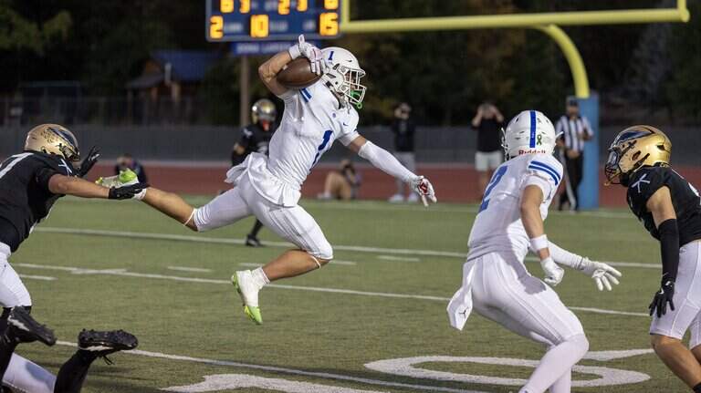 PHOTOS: Timberline scores big against Capital in crosstown game
