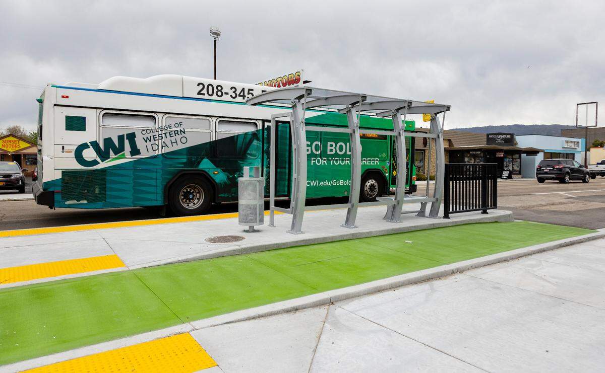 A Valley Regional Transit bus drives past a newly upgraded stop at West Fairview Avenue and Sorth 24th Street in downtown Boise before it was operational on May 5, 2022. The bus stop incorporates raised concrete next to the bicycle lane, painted in green, as a buffer between cyclists and motorists.