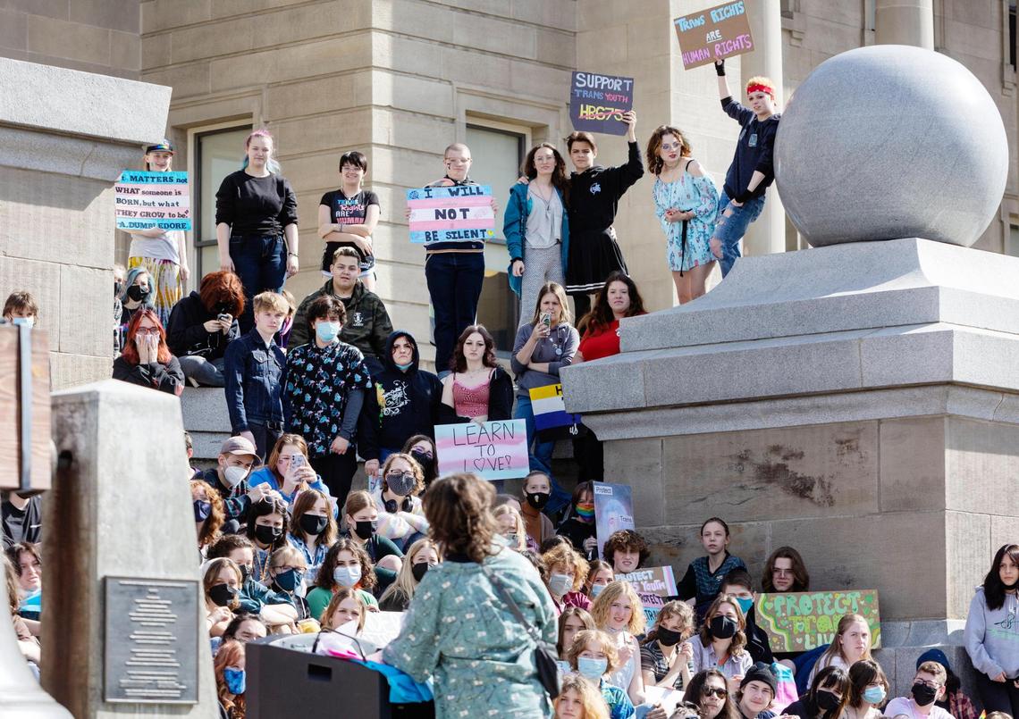 Robin Olsen speaks while people fill the steps of the Idaho Capitol during a rally to support transgender youth Friday.