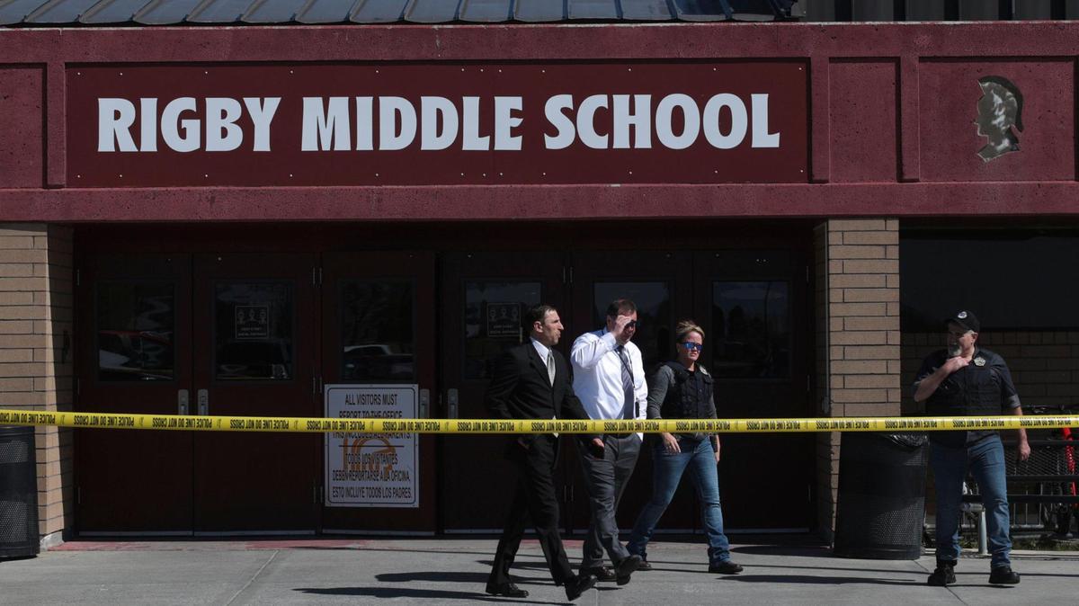 Officers leave Rigby Middle School after a shooting on May 6.