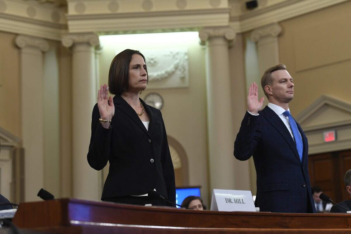 National Security Council official Fiona Hill and State department official David Holmes are sworn in before they testify before the Permanent Select Committee on Intelligence on Nov. 21, 2019. Jg29694