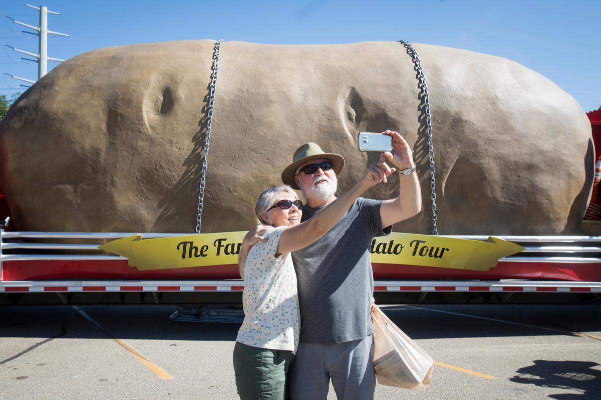 Larry and Dorothy Smith were out for a walk around their neighborhood when they spied the just-unveiled new and improved Big Idaho Potato. Larry, who grew up in Eastern Idaho planting, tending and harvesting spuds, once told his father he wanted nothing more to do with potatoes. "And here I am," he laughed, taking a selfie. "I can't get away from them." He does confess to a huge fondness for french fries.